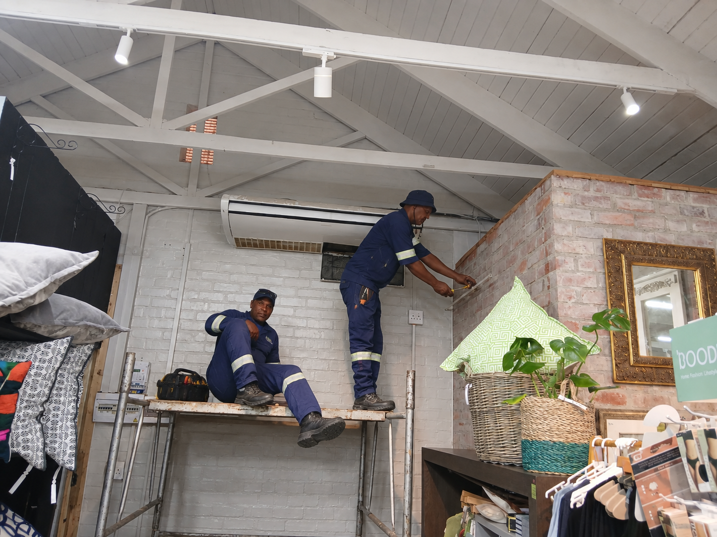 Swiftech Service technicians installing an air conditioner together